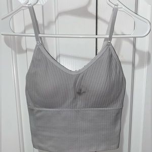 White ribbed sports tank with removable pads.